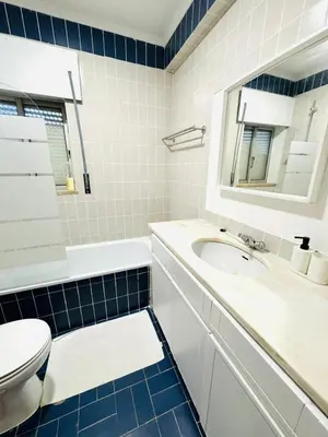 a bathroom with a sink and a toilet and a mirror at Apartment in Vilamoura Park in Quarteira