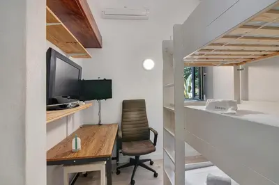a home office with a desk and a chair at Bento Box Villa Family Hub Fitness in Vilamoura