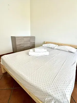 a bed with two pillows on it in a room at Fabulous Praia dos Pescadores in Albufeira