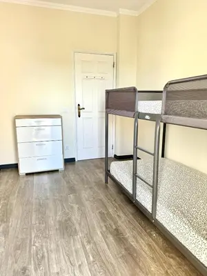 two bunk beds in a room with a wooden floor at Fabulous Praia dos Pescadores in Albufeira