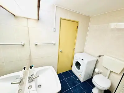 a bathroom with a white sink and a toilet at Condominio privado T1 Rua da Oura in Albufeira