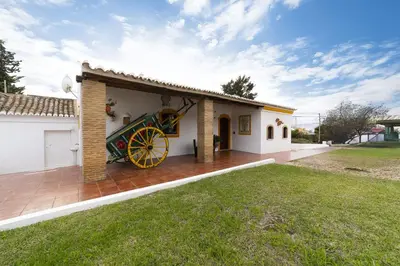 a house with a yellow wheel on a patio at Villa Monte Domingos Simoes in Albufeira