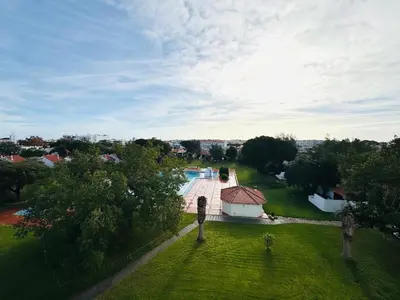 an aerial view of a yard with a swimming pool at Condominio vila nova T1 Rua da Oura in Albufeira