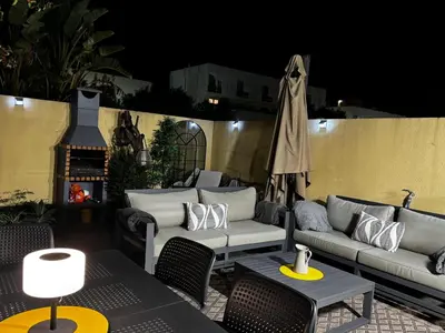 a kitchen with white cabinets and a white refrigerator at Boa Vida in Vilamoura