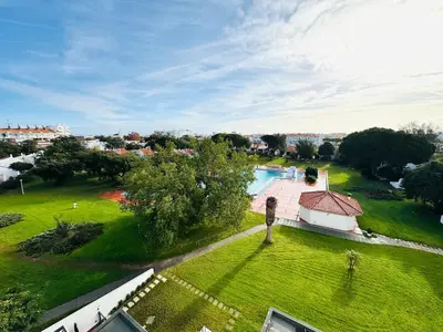 an aerial view of a yard with a swimming pool at Studio Vila Nova in Albufeira