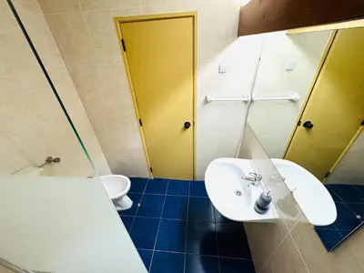a bathroom with a sink and a toilet at Studio Vila Nova in Albufeira