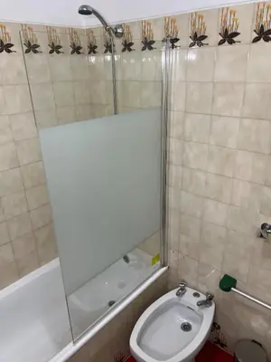 a bathroom with a toilet and a shower and a sink at Red Apartament Praia da Oura in Albufeira