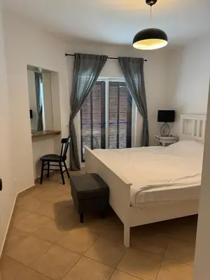 a bedroom with a bed and a desk and a chair at Lovely 3 Bedroom Home in a Resort in Albufeira in Albufeira