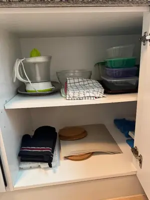 a cupboard filled with lots of kitchen utensils at Lovely 3 Bedroom Home in a Resort in Albufeira in Albufeira