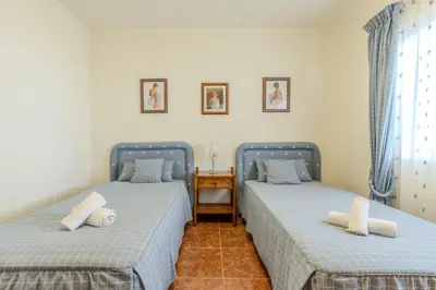 two beds sitting next to each other in a room at #350 Retiro do Abade by Home Holidays in Ferreiras