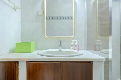 a bathroom with a sink and a mirror at #350 Retiro do Abade by Home Holidays in Ferreiras