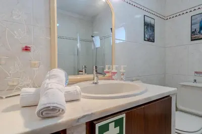 a bathroom with a sink and a toilet at #350 Retiro do Abade by Home Holidays in Ferreiras