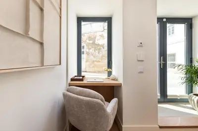 a room with a desk and a chair next to a door at BLQ Charneco 1BDR in Boliqueime by LovelyStay in Boliqueime