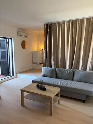 a living room with a couch and a coffee table at Cozy and chic apartment in Albufeira