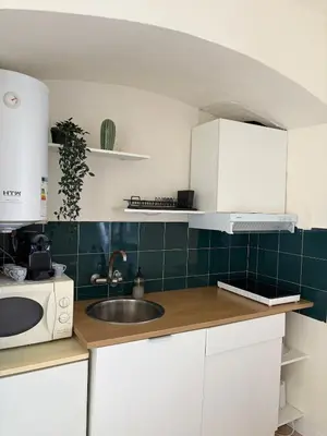 a kitchen with a sink and a microwave at Cozy and chic apartment in Albufeira