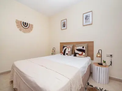 a bedroom with a large white bed with pillows at Akisol Albufeira Orion in Albufeira