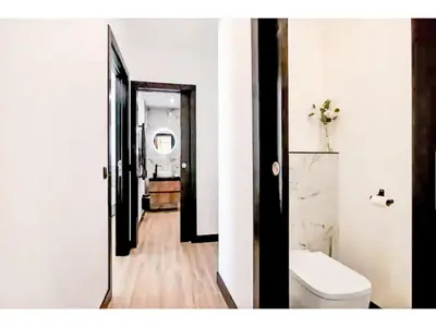 a bathroom with a toilet and a hallway at Holiday Home Gina - Sunny Way by Interhome in Albufeira