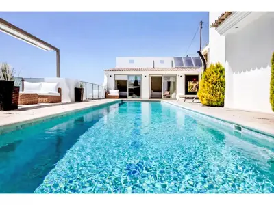 a swimming pool in front of a house at Holiday Home Gina - Sunny Way by Interhome in Albufeira