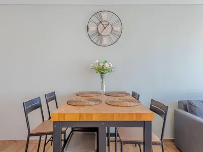 a patio with a table and chairs on a balcony at Apartment Viva One - Vip Properties by Interhome in Albufeira