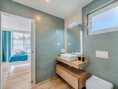 a bathroom with a sink and a toilet at Apartment Viva One - Vip Properties by Interhome in Albufeira