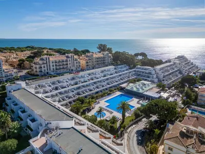 a bedroom with a bed and a large window at Apartment Viva One - Vip Properties by Interhome in Albufeira