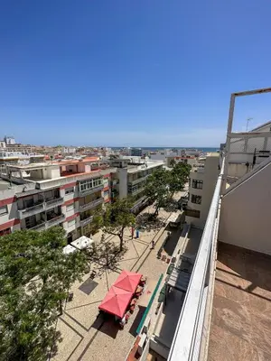 a view of a city from the balcony of a building at Quarteira Atlantic View in Sesmarias