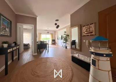 a living room with a lighthouse in the middle of a room at MyStay - Farol Moura in Quarteira
