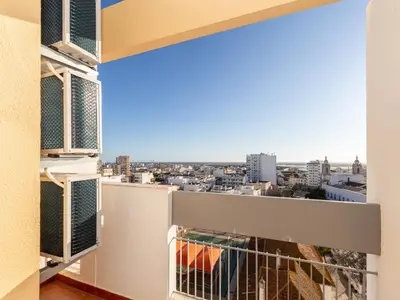 a balcony with a view of a city at Akisol Faro Virtuous in Faro