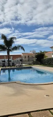 a large swimming pool in front of a building at Spacious 2 Bedroom Condo in Albufeira in Albufeira