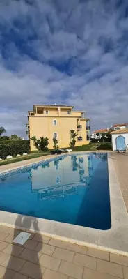 a large swimming pool in front of a building at Spacious 2 Bedroom Condo in Albufeira in Albufeira