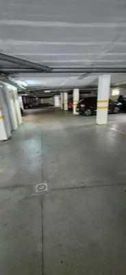 an underground parking garage with cars parked in it at Spacious 2 Bedroom Condo in Albufeira in Albufeira