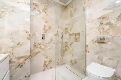 a bathroom with a shower and a toilet at Talia Lux - two-bedroom luxury apartment by HD in Vilamoura