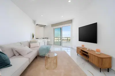 a living room with a couch and a flat screen tv at Talia Lux - two-bedroom luxury apartment by HD in Vilamoura