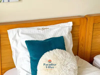 a pillow sitting on top of a bed at Two Bedroom Apartment with Sea Views in Albufeira in Albufeira