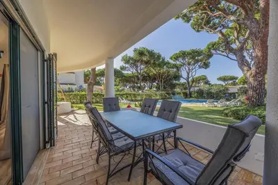 a living room with a couch and a tv at Joliet in Vilamoura