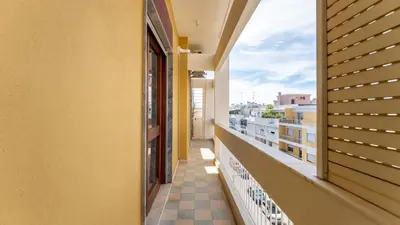 a balcony with a view of a building at Cosy 3Bdr Flat near University by LovelyStay in Faro