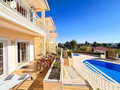 a villa with a swimming pool and a house at Balaia Poolside House with Sea View by BeCherish in Atalaia