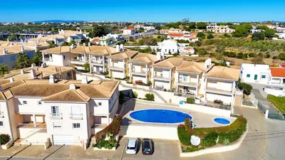 an aerial view of a house with a pool at Balaia Poolside House with Sea View by BeCherish in Atalaia