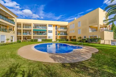 an apartment building with a pool in the yard at Peaceful 2Bdr with Pool in Vilamoura by LovelyStay in Quarteira