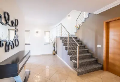 a staircase in a home with white walls at Villa Sierra in Guia