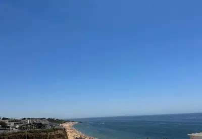 a view of a beach with the ocean at Playa Vista guest house in Albufeira