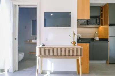 a living room with a couch and a table at Faro Old Town Apartments in Faro