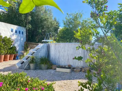 a garden with a fence and some plants at Holiday Home Vila Verão Nur für Erwachsene by Interhome in Santa Bárbara de Nexe