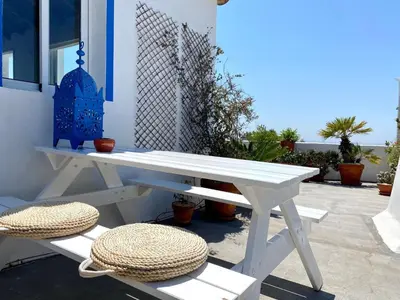 a white picnic table and bench with a straw hat at Holiday Home Vila Verão Nur für Erwachsene by Interhome in Santa Bárbara de Nexe