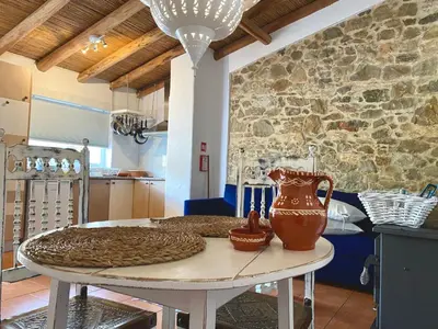 a table with a vase sitting on top of it at Holiday Home Vila Primaveira - Nur für Erwachsene by Interhome in Santa Bárbara de Nexe