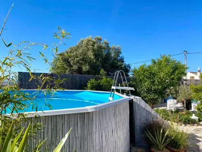 a swimming pool in a backyard with a fence at Holiday Home Vila Primaveira - Nur für Erwachsene by Interhome in Santa Bárbara de Nexe
