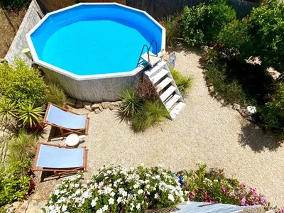an overhead view of a swimming pool with chairs and a tub at Holiday Home Vila Primaveira - Nur für Erwachsene by Interhome in Santa Bárbara de Nexe
