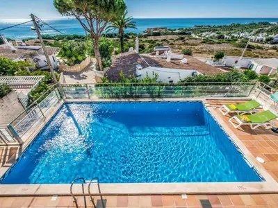 a swimming pool with a view of the ocean at Holiday Home Chalet Villa Oceano mit privatem Pool by Interhome in Albufeira