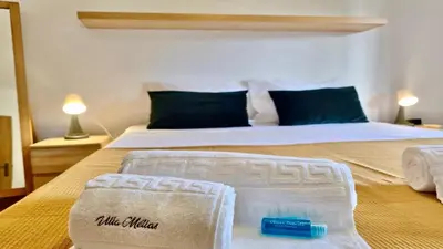 a hotel room with a bed with two towels on it at Melias apartment - Cleverdetails, Vilamoura in Vilamoura