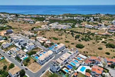 an aerial view of a city with houses and the ocean at Casa Jokpa Mar Near So Rafael Beach in Albufeira